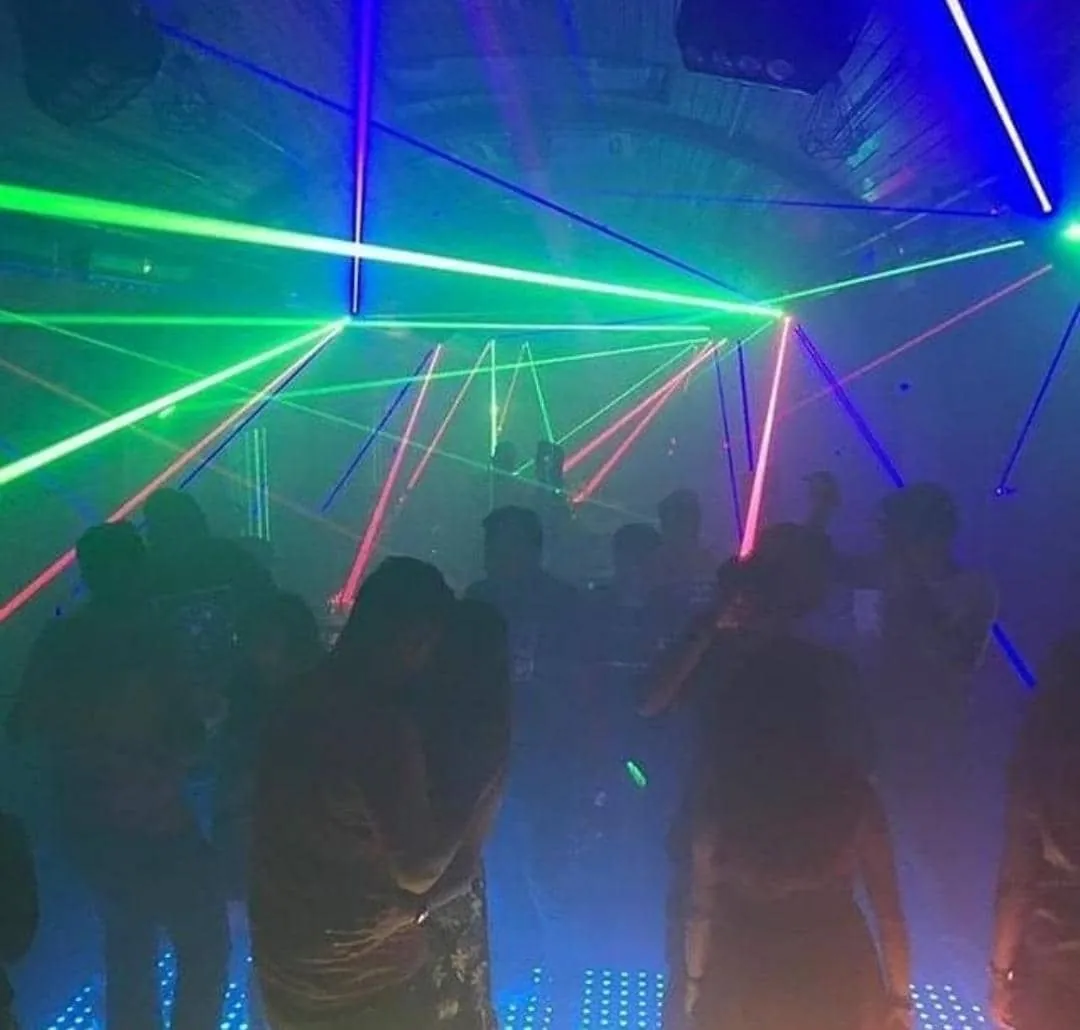 Lasers cutting across a packed dance floor at Hideout Club